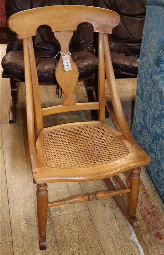 A Victorian caned beech rocking chair